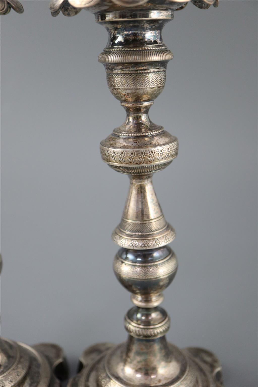 Two 19th century Brazilian? cast silver candlesticks,
